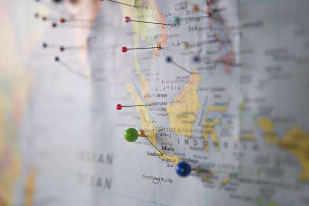 Map of South East Asia with drawing pins in multiple locations, one of them being Singapore